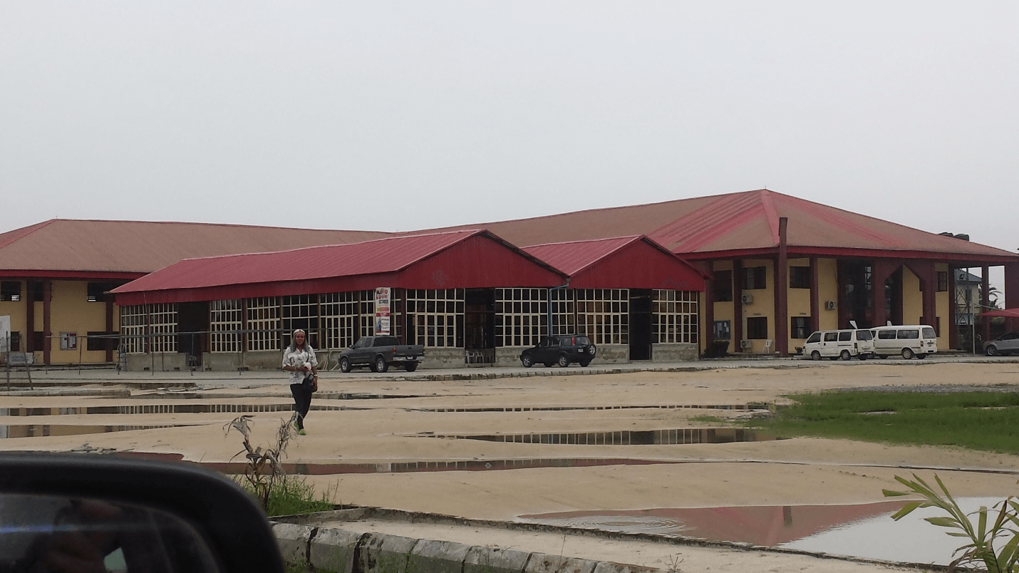 D. Scenic view of the completed L shaped Church hall with an attached School building.